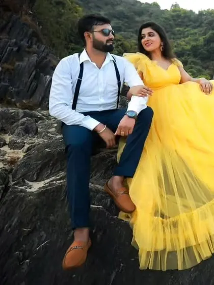 A sunny pre-wedding shoot on the rocks. The bride-to-be is wearing a bright yellow tulle gown that brings so much joy and vibrancy to the photos.