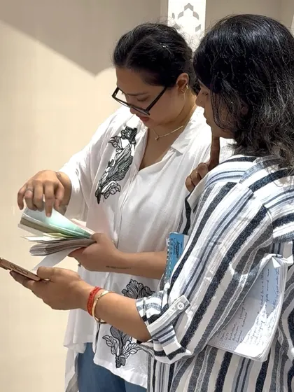 The design process is a conversation. Here, our architects are reviewing material swatches with a client, a collaborative step that ensures the final palette perfectly matches their vision.