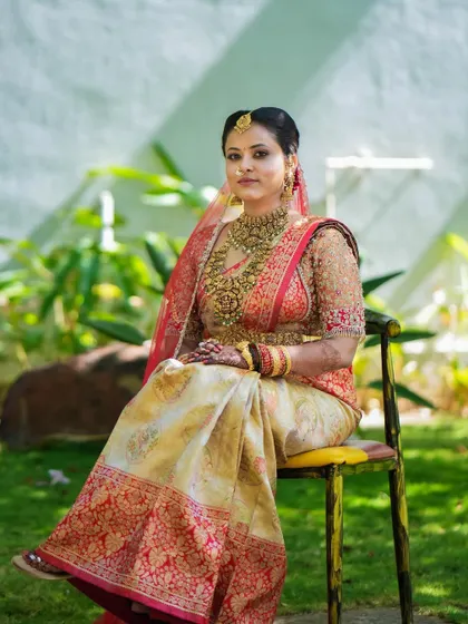 A beautiful outdoor shot of a bride on her wedding day. The natural light shows off the flawless yet understated makeup that enhances her features.