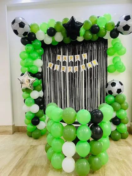 The complete football goal balloon decoration, ready for a young sports fan's birthday party.