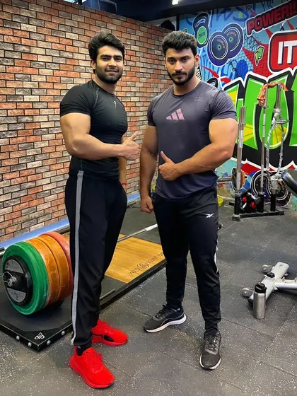 With my brother in the gym. We push each other to be better.
