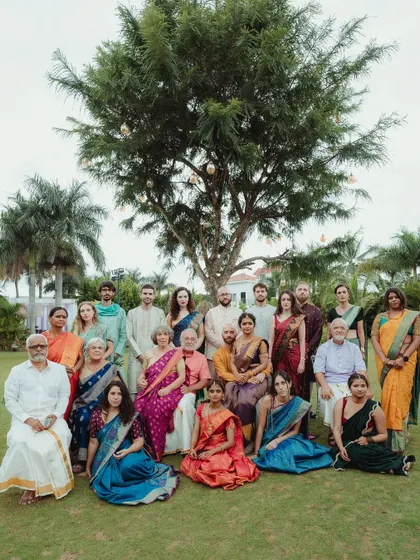 A beautiful family portrait from a cross-cultural wedding, showcasing the blend of two families. We make sure to capture not just the couple, but the joining of their loved ones.