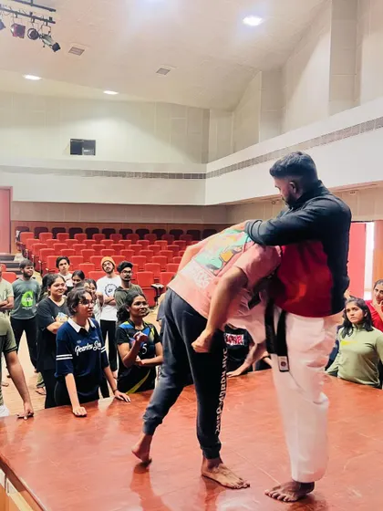 A student practices a defensive maneuver to break free from a hold, a key technique taught in our self-protection program.
