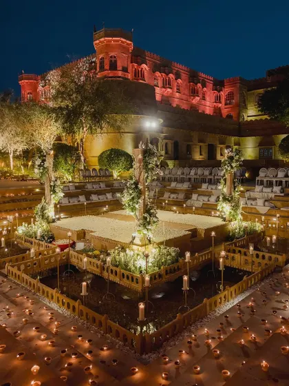 A look back at a magical wedding mandap at Suryagarh, Jaisalmer. The structure, surrounded by diyas and set against the illuminated palace, showcases our expertise in creating dramatic and romantic settings for royal destination weddings.