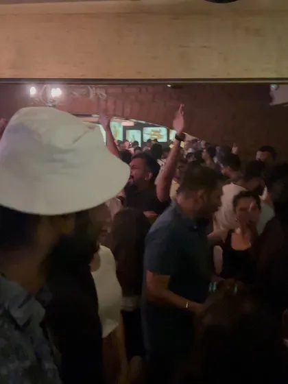 The crowd at Watson's with their hands in the air. It doesn't matter the size of the venue, I always get the party started.