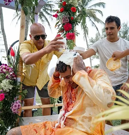 More Haldi shenanigans, with the groom getting a full 'champi' of curd and turmeric.