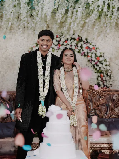 The cake-cutting ceremony. The couple looks happy and radiant, and the makeup is designed to last through all the moments of the celebration.