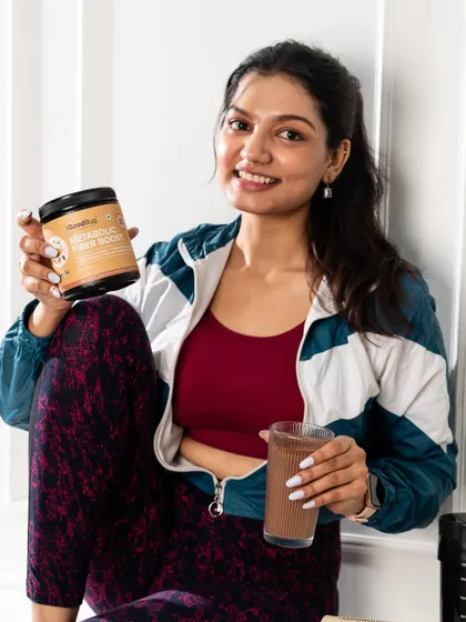 A post-workout themed shot for a metabolic fiber boost product. The styling connects the product directly to a fitness-oriented lifestyle.