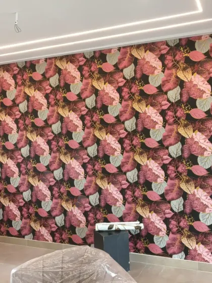 A bold and colorful wallpaper featuring large autumn leaves. The rich pinks and reds make a strong design statement.