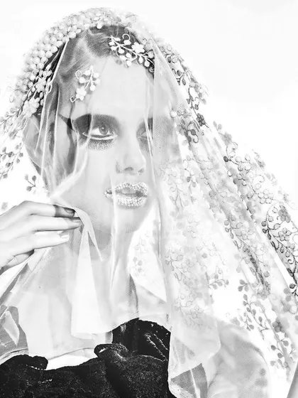 A close-up beauty shot where the focus is on the intricate details. For this look with Vandana Fabrics, we used a delicate lace veil and crystalized lips to create a high-fashion, artistic statement.