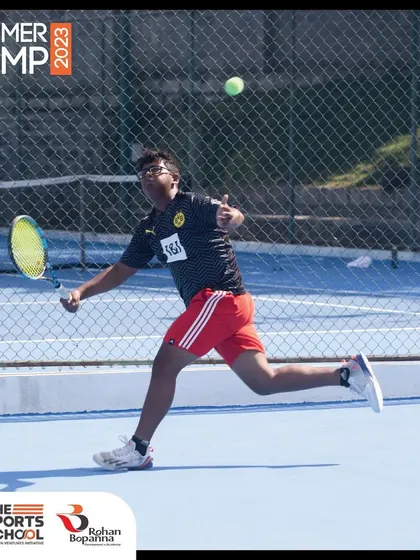A player lunges for a forehand during our 2023 Summer Camp. The camp combines intense training with fun, creating an unforgettable summer of sports and personal growth.