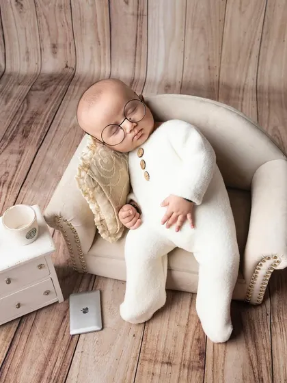 Hard at work in dreamland. This cute setup with tiny glasses and a miniature laptop is a playful take on the modern working world.