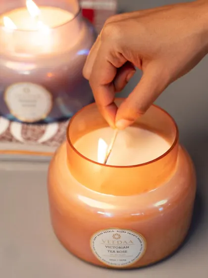 A moment of ignition. Lighting our Victorian Tea Rose candle is the start of a beautiful sensory experience, filling the room with warmth and a delicate floral scent.