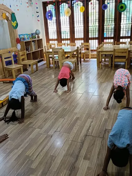 Our little Asters practicing the downward dog pose. These fun animal poses make yoga relatable and enjoyable for kids.