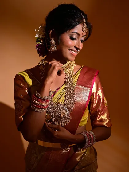 Another beautiful, smiling shot that shows how the makeup moves with the bride's expressions. The lipstick is chosen to brighten her smile, and the skin looks supple and real.