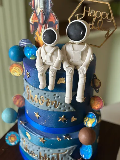 From planets to rockets, this galaxy cake has it all. This two-tiered space-themed cake features handcrafted astronauts and colorful planets to take your celebration to the stars.