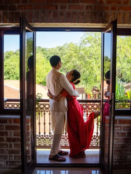Finding those picture-perfect spots at the venue. This moment on the balcony became one of our favorite wedding photos, a quiet pause in a day full of celebration.