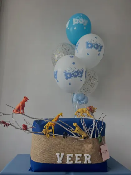 The jungle-themed hamper for Veer with its accompanying balloon bouquet.