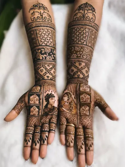 This portrait-themed bridal mehndi captures the essence of a traditional Indian bride and groom. The design also includes Ambari elephants, a symbol of royalty and celebration.
