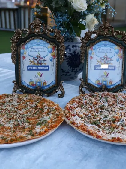 Food brings us together. Here are two of our specialty pizzas, a perfect addition to any party menu, loved by guests of all ages.
