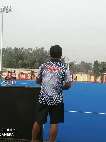 A coach's perspective, observing the game from the sidelines. Constant analysis and motivation are key to pushing the team to achieve its full potential.