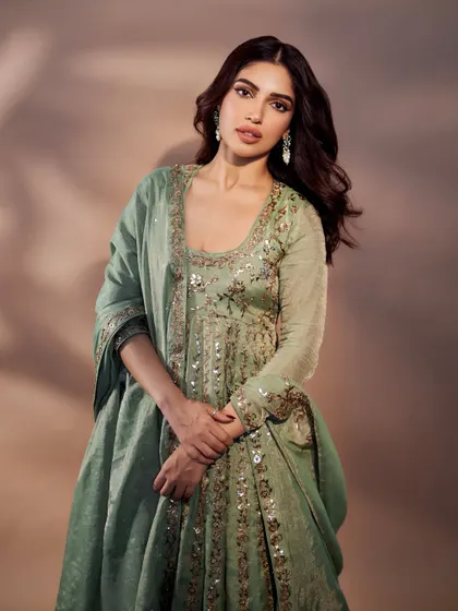 Bhumi Pednekar in a graceful mint green Anarkali. The subtle sequin work and soft color make it a sophisticated choice for a formal daytime event.