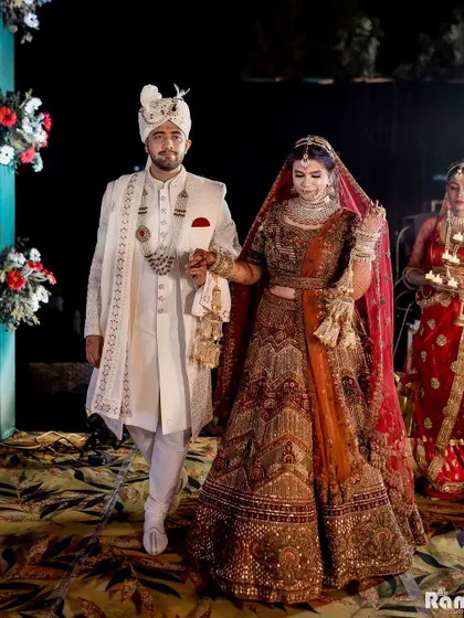 The couple's grand entrance, walking hand-in-hand down the aisle, ready to begin their new life together.