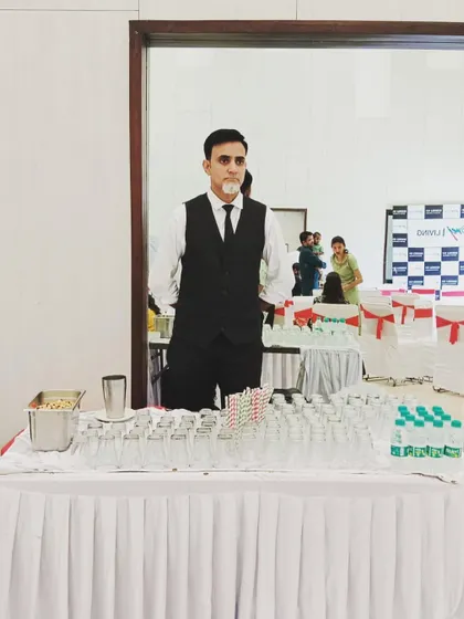 A full view of our bartender at his station, ready for a full-day corporate catering event.