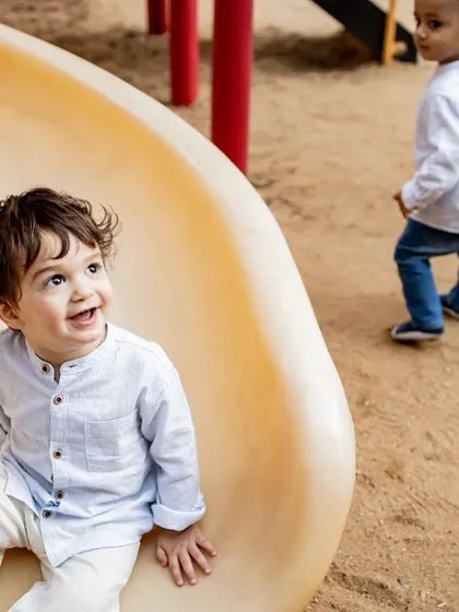 Documenting families over the years is so special. Here's a fun, animated moment of a little boy I've been photographing for years, enjoying the slide at the park.