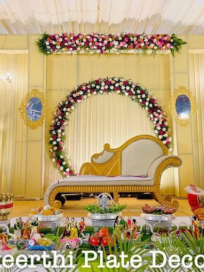 This engagement setup at VSG Mahal features a beautiful floral arch backdrop. My platter arrangements in the front are designed to match the grandeur of the stage.