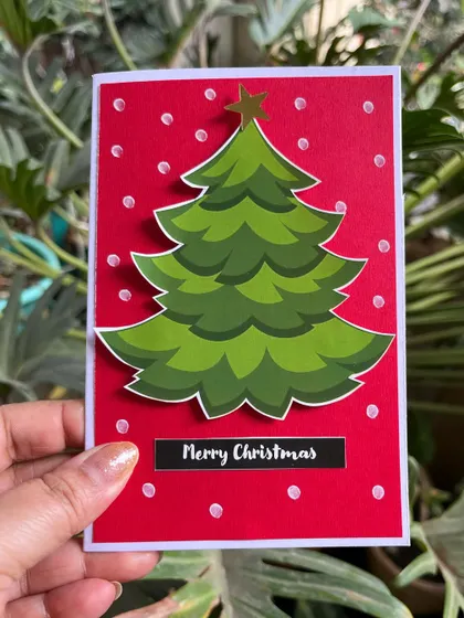 A still image of our popular Christmas tree card, showing the crisp details and vibrant red background.