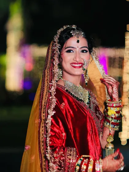 A close-up of the bride's happy expression. The makeup is designed to last through all the smiles and happy tears of the wedding day.