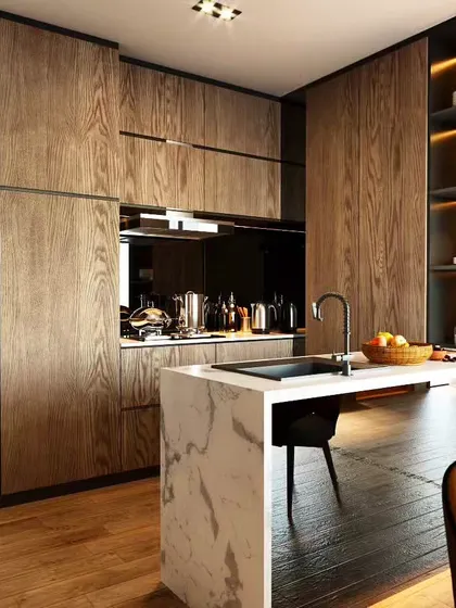 This premium kitchen features a marble-topped island with an integrated sink. The floor-to-ceiling wood cabinetry conceals appliances and provides ample storage.