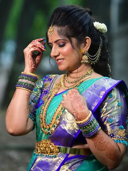 A lovely photo from my client Rashmi, showcasing her complete bridal look with a traditional gold-finish haram and matching accessories.