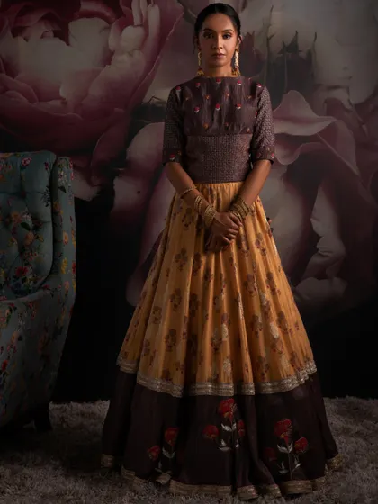 Let my couture creations adorn your special occasions. This unique lehenga with a mustard yellow and brown tiered skirt is perfect for a wholesome Haldi ceremony.