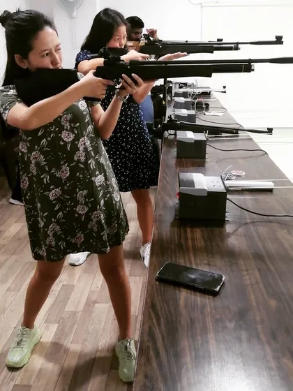 Even in a dress, you can get into the shooting spirit. The sport is accessible to everyone, and I make sure the environment is welcoming for all.