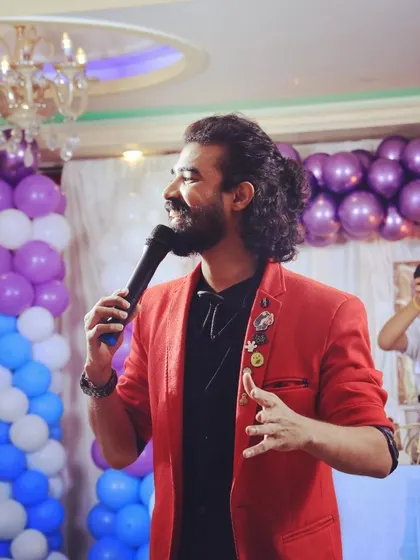 A happy, candid moment on stage, interacting with guests and enjoying the flow of the event.