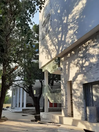 Glimpses of our ongoing project for the Koba Jain Museum. The pristine white structure is lifted on stilts and nestled among existing trees, creating a serene pavilion that invites community interaction and feels light upon the earth.