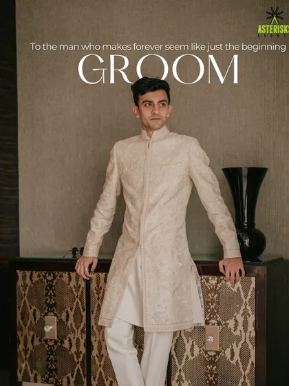 A stylish portrait of the groom in his elegant off-white sherwani, looking sharp and ready for his big day.