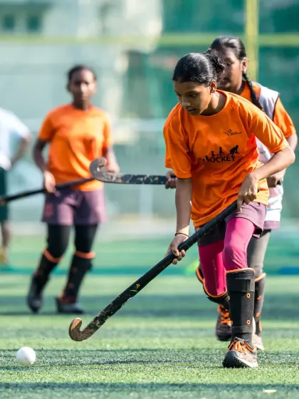 With eyes on the ball, a young player advances down the field. This image captures the focus and drive we instill in our campers, encouraging them to always play with purpose.