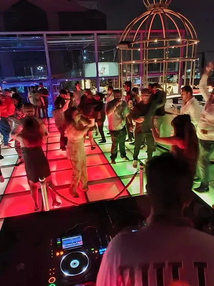 A glimpse of the crowd dancing on the iconic lit floor at Skyye. I love seeing everyone enjoying the music and the view.