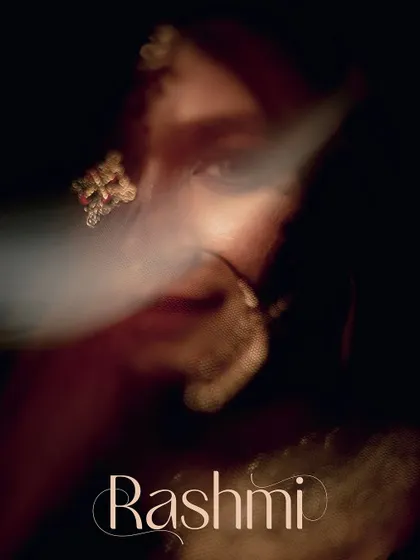 A creative and mysterious close-up of the bride's face, partially obscured by a soft blur, creating an artistic and intriguing portrait.