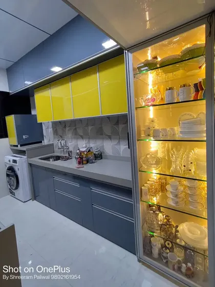 This shot highlights the elegant, full-height glass crockery unit I designed for the Savla's kitchen. The internal lighting turns their dinnerware into a beautiful display piece.