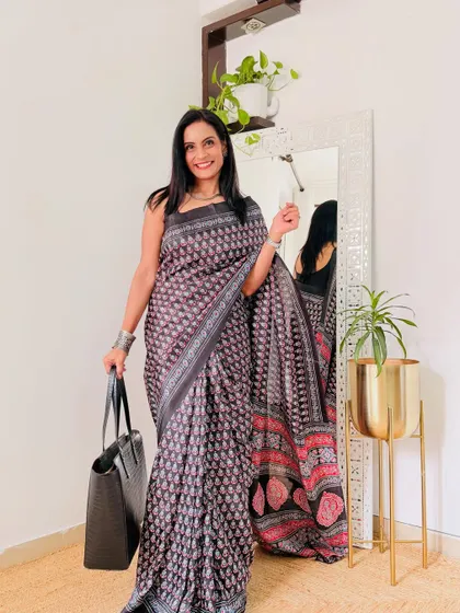 A subtle grey printed saree that is perfect for a formal office environment. The print is elegant and the fabric is comfortable for long hours.