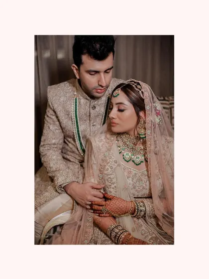 An intimate and tender portrait. The couple shares a quiet moment, their heads close together, showcasing the deep emotional connection and trust between them.