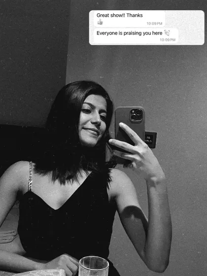 That post-show dopamine kick is real. This selfie captures that feeling right after a successful corporate annual show, with a client's "Great show!" text making it all the more sweet.