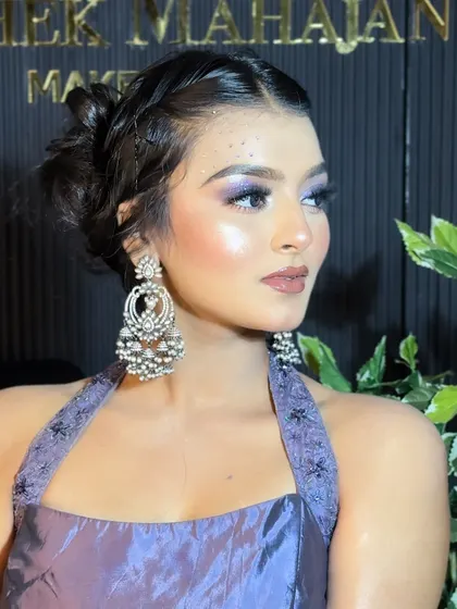 A side profile of the dreamy party look, showcasing the elegant updo and stunning earrings.
