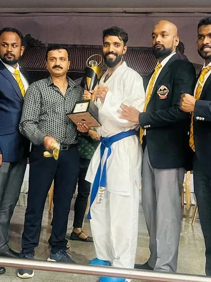 A close-up of our champion receiving his trophy at the YMCI state competition.