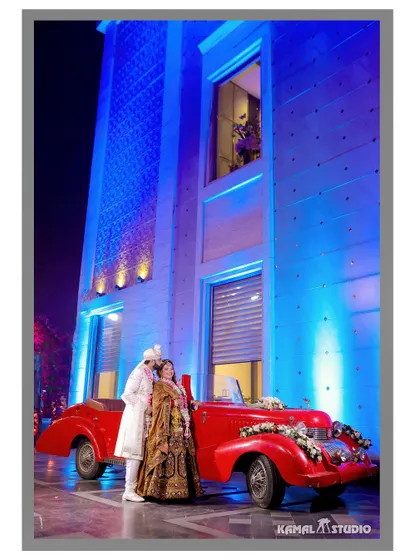 Adding a touch of vintage glamour with a classic car. Props like these help tell a story and add a unique, stylistic flair to your pre-wedding photos, making them stand out.