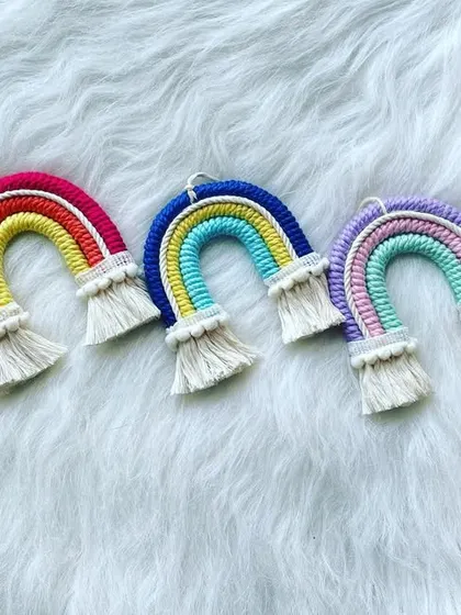 A lineup of my classic macrame rainbows, ready to be shipped out. Seeing all the different color combinations together always makes me happy.